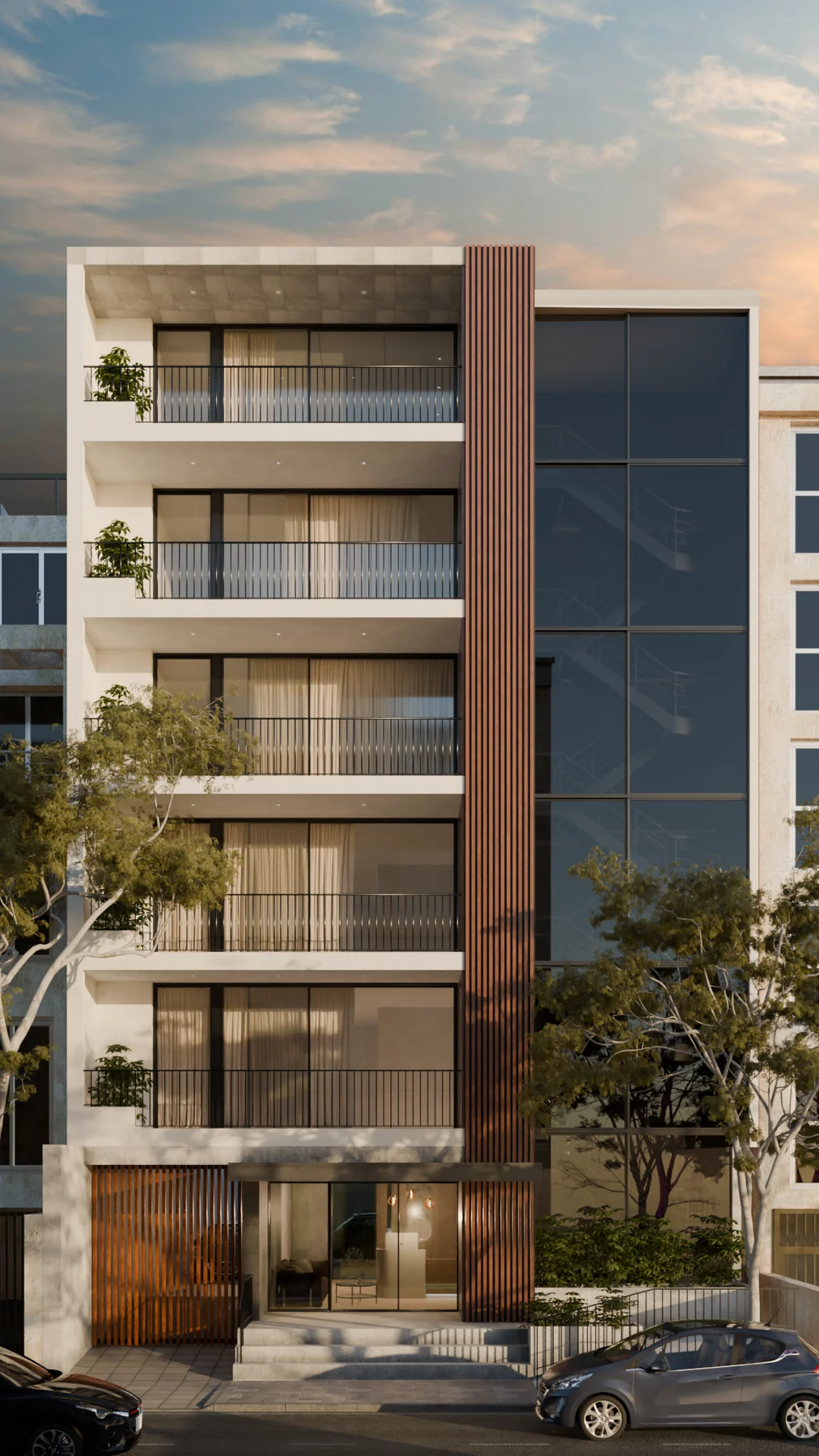 Street elevation of the building at dusk, balconies and vertical timber spine